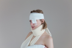 Bandaged injured sex slave