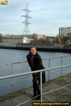 Pissing on the bridge over river - N