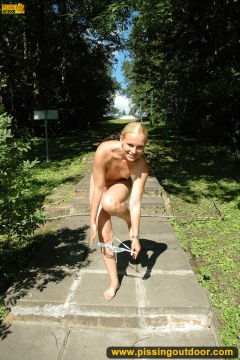 Outdoor pissing of walking naked blonde - N