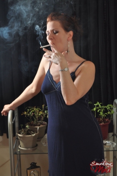 Sexy Mina in a sexy blue dress blowing ring smokes - N